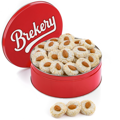Brekery almond cookies in a red tin, topped with whole almonds