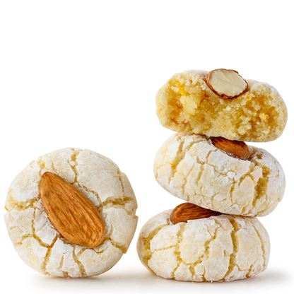 Brekery almond cookies stacked, one broken to show texture